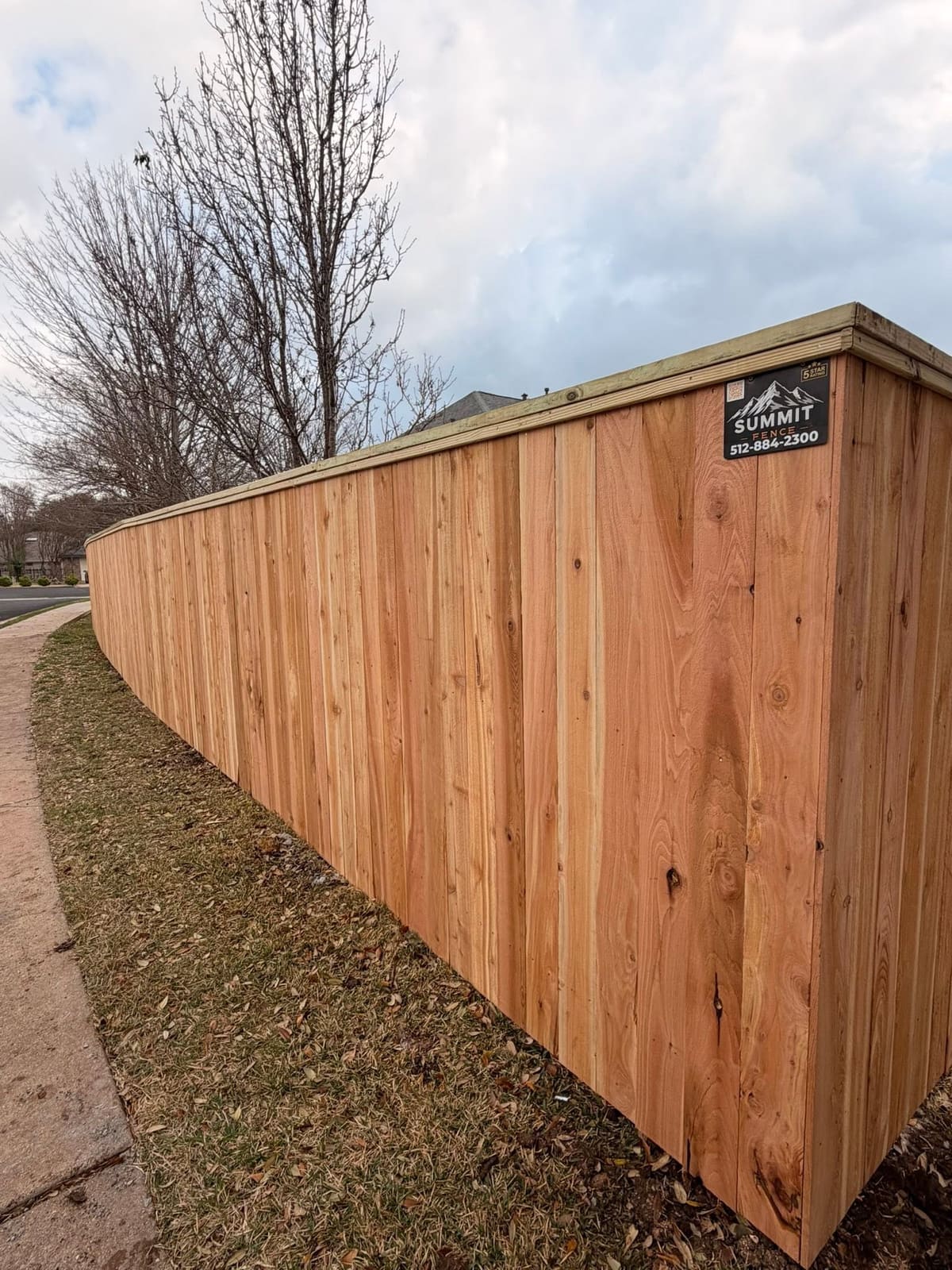 Board-on-Board Cedar Fence with Cap Rail in Austin